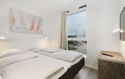 Ein Bett oder Betten in einem Zimmer der Unterkunft Priwallpromenade 1, Whg 5