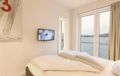 Ein Bett oder Betten in einem Zimmer der Unterkunft Priwallpromenade 1, Whg 6