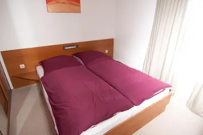 Ein Bett oder Betten in einem Zimmer der Unterkunft Ferienwohnung direkt am Strand der Ostsee