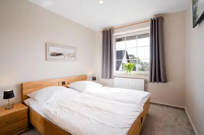 Ein Bett oder Betten in einem Zimmer der Unterkunft (DKK9)- Ferienwohnung Möwennest