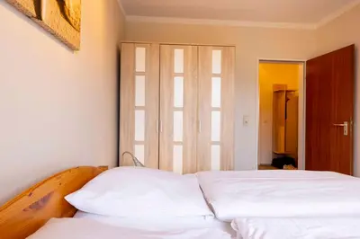 Ein Bett oder Betten in einem Zimmer der Unterkunft (DKK11) Ferienwohnung Strandburg