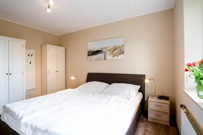 Ein Bett oder Betten in einem Zimmer der Unterkunft (DKK1e) Ferienwohnung Seepferdchen