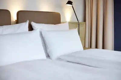Ein Bett oder Betten in einem Zimmer der Unterkunft arborea Marina Resort Neustadt