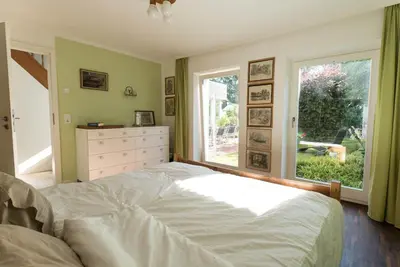 Ein Bett oder Betten in einem Zimmer der Unterkunft Refugium Lübeck