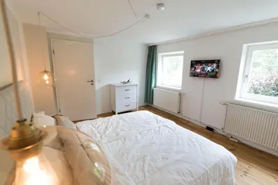 Ein Bett oder Betten in einem Zimmer der Unterkunft Refugium Lübeck
