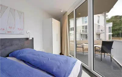 Ein Bett oder Betten in einem Zimmer der Unterkunft Dünenvilla 13, Whg 6