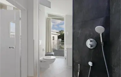 Ein Badezimmer in der Unterkunft Dünenvilla 13, Whg 9