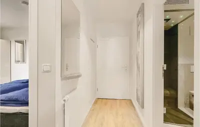 Ein Bett oder Betten in einem Zimmer der Unterkunft Dünenvilla 14, Whg 7