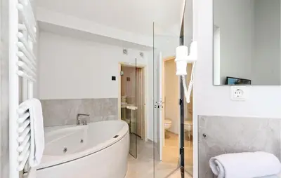 Ein Badezimmer in der Unterkunft Dünenvilla 15, Whg 10