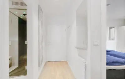 Ein Bett oder Betten in einem Zimmer der Unterkunft Dünenvilla 16, Whg 7