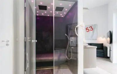 Ein Badezimmer in der Unterkunft Dünenvilla 16, Whg 10