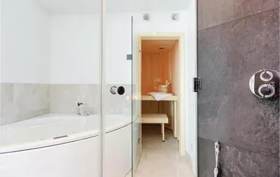 Ein Badezimmer in der Unterkunft Dünenvilla 16, Whg 10