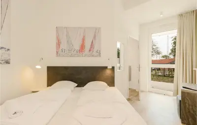 Ein Bett oder Betten in einem Zimmer der Unterkunft Highend Travemünde - Whg 10
