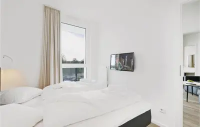 Ein Bett oder Betten in einem Zimmer der Unterkunft Highend Travemünde - Whg 114