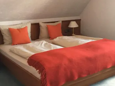 Ein Bett oder Betten in einem Zimmer der Unterkunft Wittlers Hotel