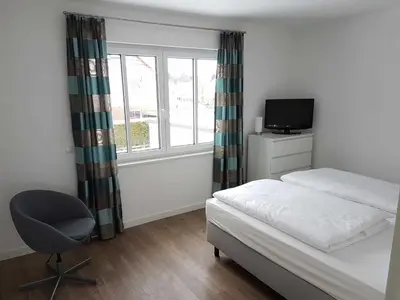 Ein Bett oder Betten in einem Zimmer der Unterkunft Pier 76