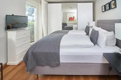 Ein Bett oder Betten in einem Zimmer der Unterkunft Techts Apartmenthaus