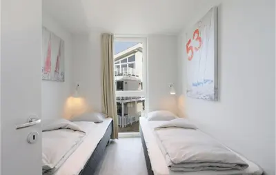 Ein Bett oder Betten in einem Zimmer der Unterkunft Dünenvilla 6, Whg 3