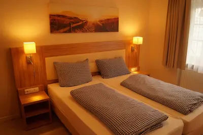 Ein Bett oder Betten in einem Zimmer der Unterkunft Landhotel Klempau