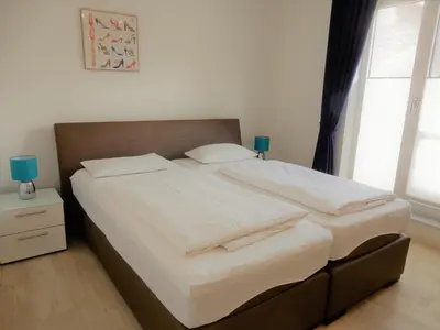 Ein Bett oder Betten in einem Zimmer der Unterkunft Exklusive familienfreundliche Ferienwohnung im Haus Aalbeek