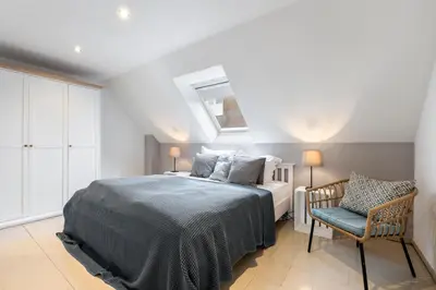 Ein Bett oder Betten in einem Zimmer der Unterkunft PEMATRA Haus Sonnenschein - FeWo Lieblingsplatz