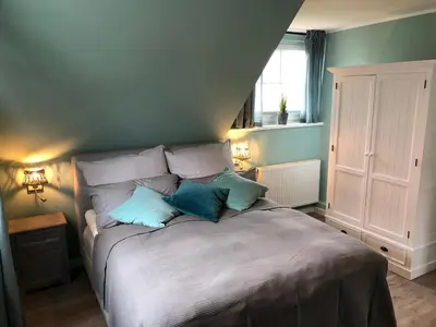 Ein Bett oder Betten in einem Zimmer der Unterkunft Neptun17