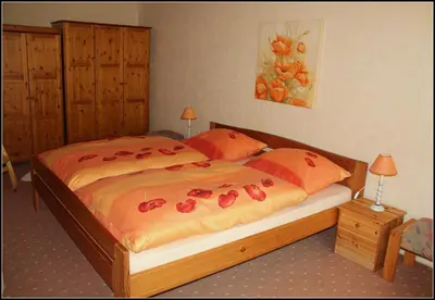 Ein Bett oder Betten in einem Zimmer der Unterkunft Ferienwohnung Fohrmann