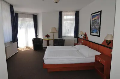 Ein Bett oder Betten in einem Zimmer der Unterkunft Hotel Stadt Reinfeld