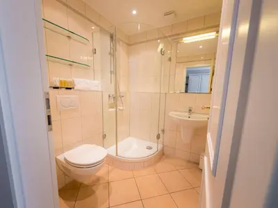 Ein Badezimmer in der Unterkunft Strandhotel Fontana