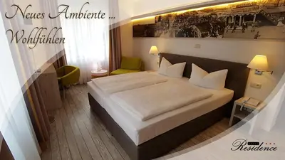 Ein Bett oder Betten in einem Zimmer der Unterkunft Hotel Residence