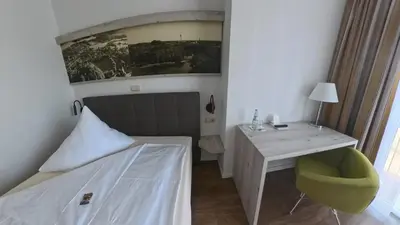 Ein Bett oder Betten in einem Zimmer der Unterkunft Hotel Residence