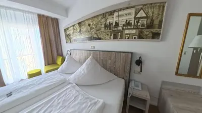 Ein Bett oder Betten in einem Zimmer der Unterkunft Hotel Residence