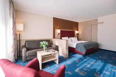 Ein Bett oder Betten in einem Zimmer der Unterkunft Hotel Royal