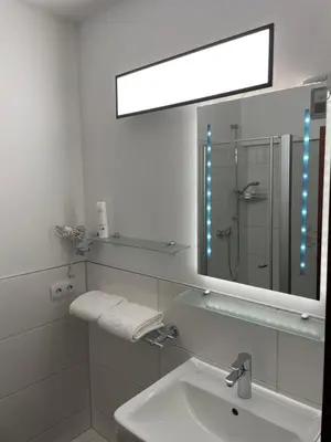 Ein Badezimmer in der Unterkunft Hotel Royal