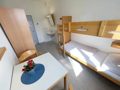 Ein Bett oder Betten in einem Zimmer der Unterkunft Jugendherberge Lübeck Vor dem Burgtor
