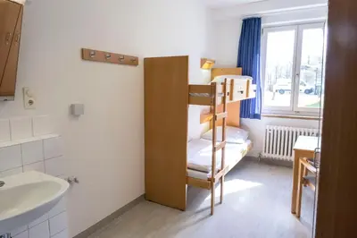 Ein Bett oder Betten in einem Zimmer der Unterkunft Jugendherberge Lübeck Vor dem Burgtor