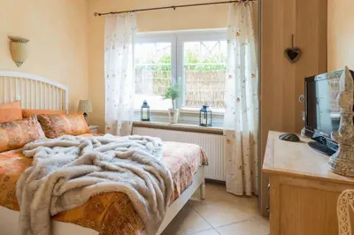 Ein Bett oder Betten in einem Zimmer der Unterkunft Altes Strandhus Casa Stranddune