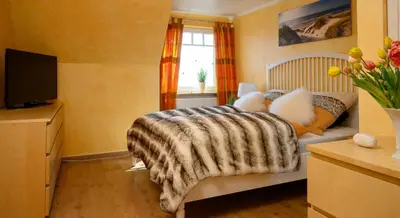Ein Bett oder Betten in einem Zimmer der Unterkunft Altes Zollhaus Casa Meerblick