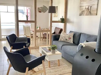 Ein Sitzbereich in der Unterkunft Hygge - skandinavisch mit Kamin und Sauna
