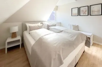Ein Bett oder Betten in einem Zimmer der Unterkunft Techts Landhus Birkenallee