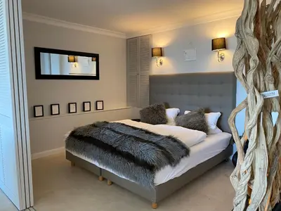 Ein Bett oder Betten in einem Zimmer der Unterkunft Suite Ostseerausch