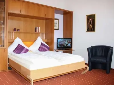 Ein Bett oder Betten in einem Zimmer der Unterkunft Waldhaus Gronenberg