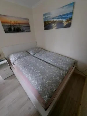 Ein Bett oder Betten in einem Zimmer der Unterkunft Ferienwohnung 