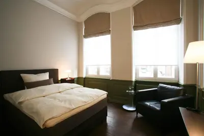 Ein Bett oder Betten in einem Zimmer der Unterkunft Hotel Anno 1216