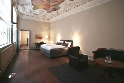 Ein Bett oder Betten in einem Zimmer der Unterkunft Hotel Anno 1216