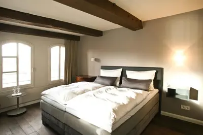 Ein Bett oder Betten in einem Zimmer der Unterkunft Hotel Anno 1216