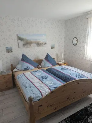 Ein Bett oder Betten in einem Zimmer der Unterkunft Gesa Kronenberger