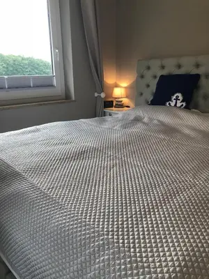 Ein Bett oder Betten in einem Zimmer der Unterkunft Strandgut 63