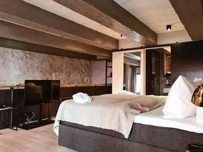 Ein Bett oder Betten in einem Zimmer der Unterkunft Fisher's Loft Hotel