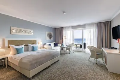 Ein Bett oder Betten in einem Zimmer der Unterkunft Mein Strandhaus - Hotel, Restaurant & Schwimmbad